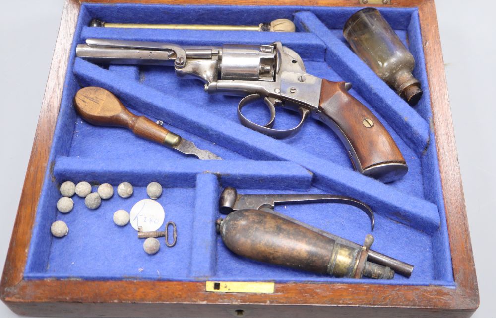 A cased self cocking five-shot double action revolver, engraved Adams London 1091,